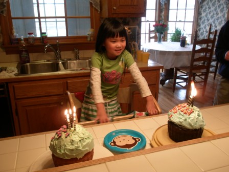 Kasen with two birthday cakes